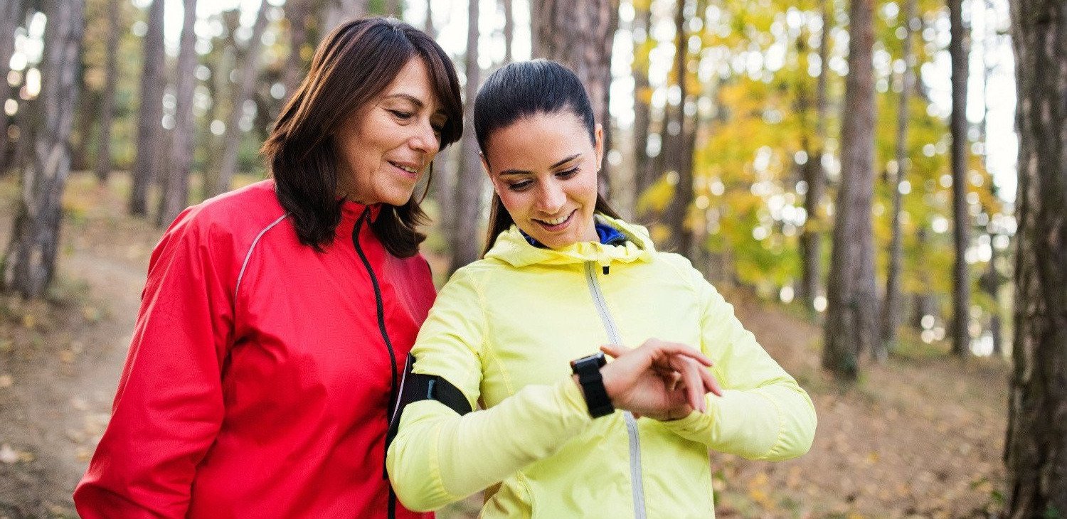 Girls running with smart watch